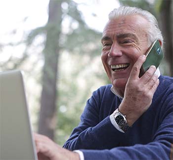 senior citizen using laptop